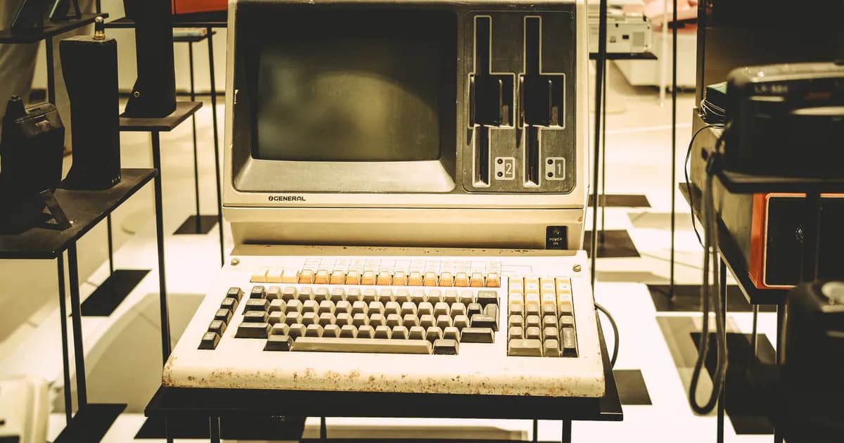 Old-fashioned General computer on display with a vintage keyboard and disk slots