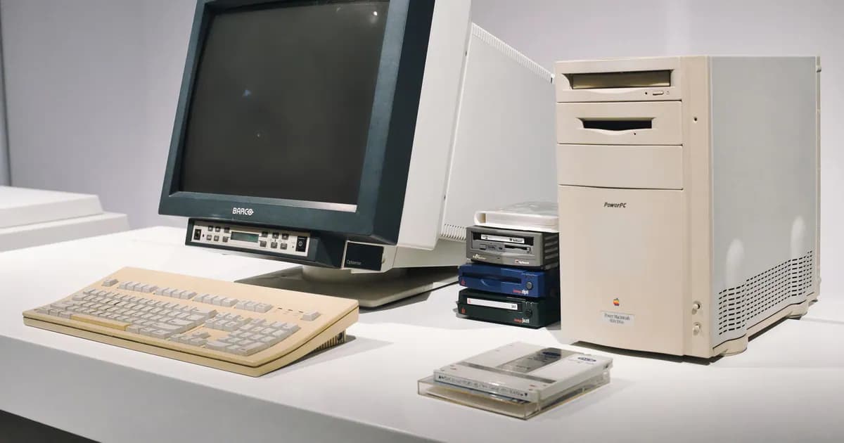 A retro computer setup featuring a classic CRT monitor and vintage CPU