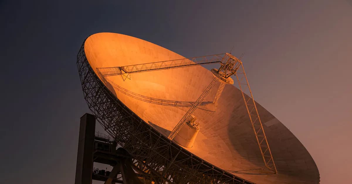 A striking satellite dish basking in golden hour light