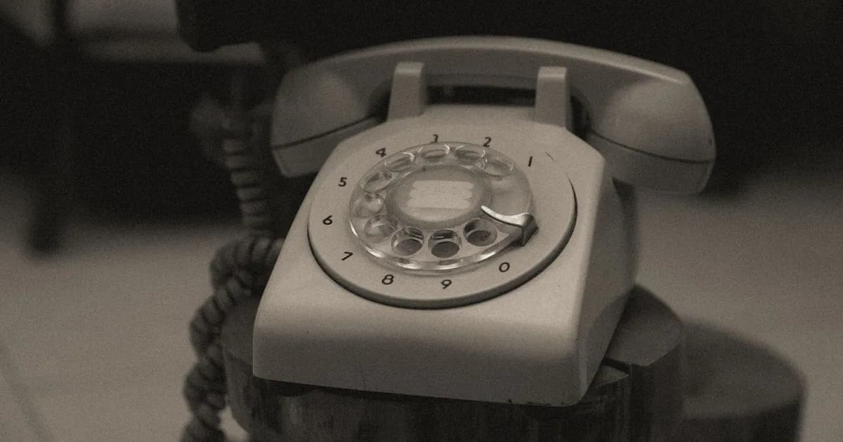 A close-up of a classic vintage rotary telephone with retro design