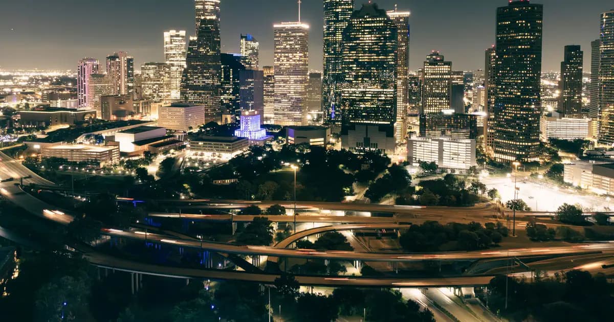 Stunning aerial view of Houston's illuminated skyline featuring skyscrapers and highways at night