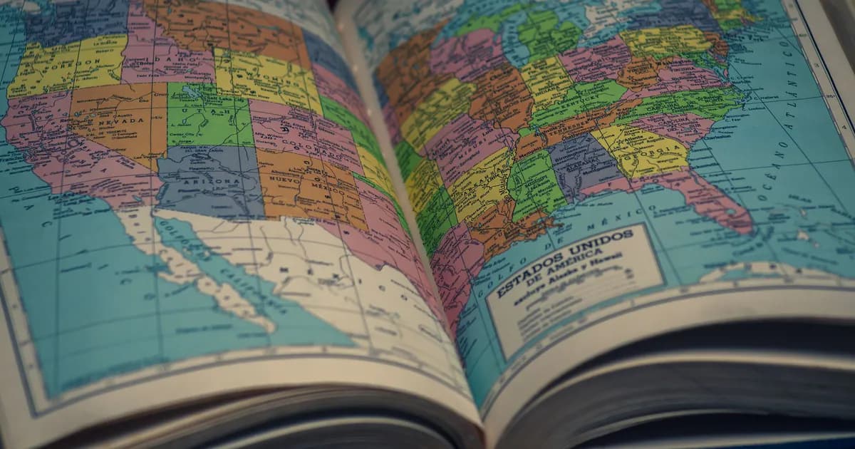 Open atlas showing a colorful map of the United States